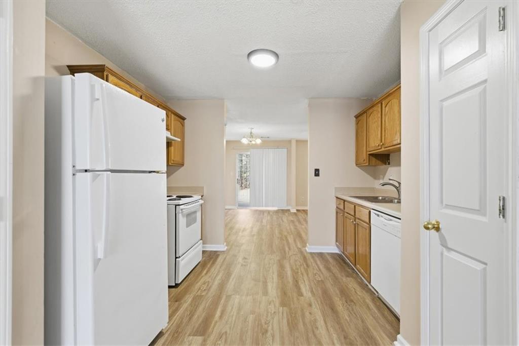 460 Parkway Road Union City, GA 30291 - Photo 7 of 18 a kitchen with a refrigerator a sink and dishwasher