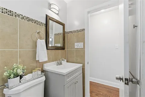 a bathroom with a sink vanity and a mirror