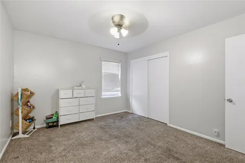a view of a livingroom with toys and closet