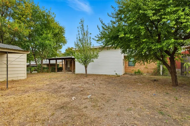 a house with trees in front of it