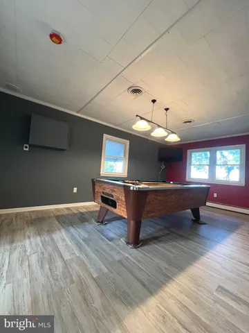 a view of outdoor space with wooden floor and windows