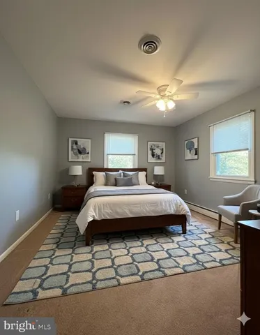 an empty room with a empty space and windows