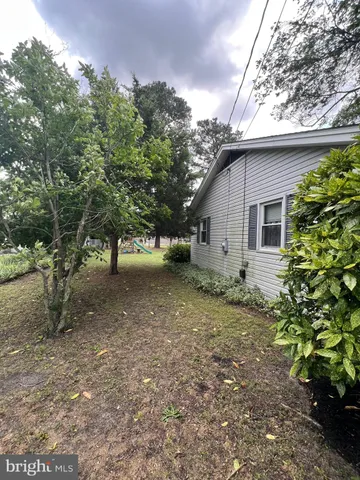a view of a house with a tree
