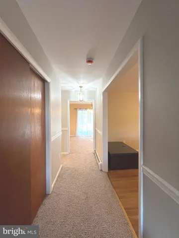a view of hallway with livingroom