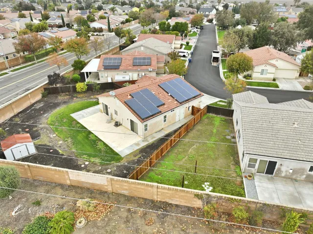 an aerial view of a house with a ocean view