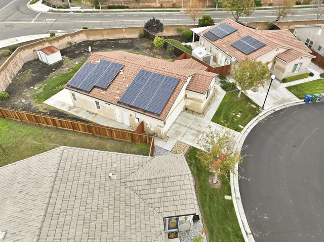 an aerial view of residential houses with outdoor space