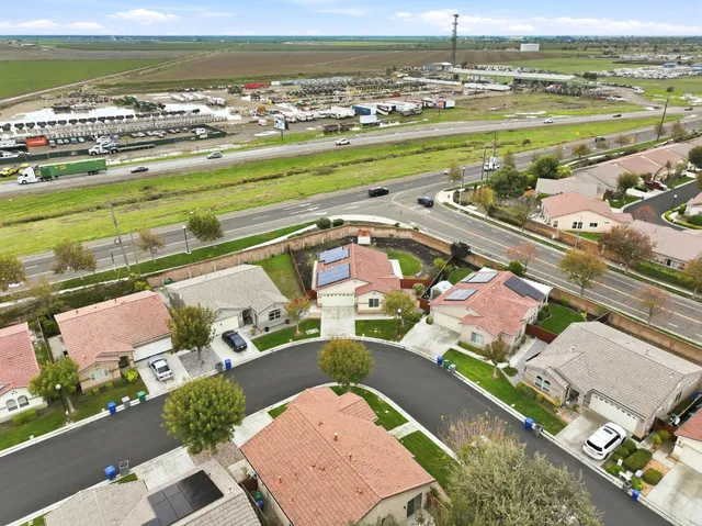 a view of an empty room with a fireplace