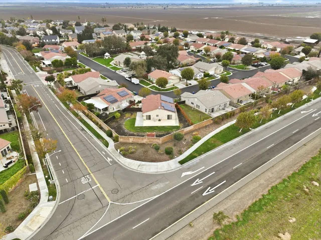 a view of an empty room with fire place and a fireplace