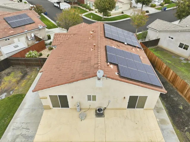 a kitchen with granite countertop a stove sink and cabinets