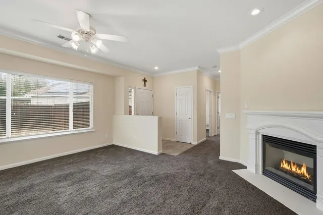 a kitchen with stainless steel appliances granite countertop a sink a stove and a refrigerator