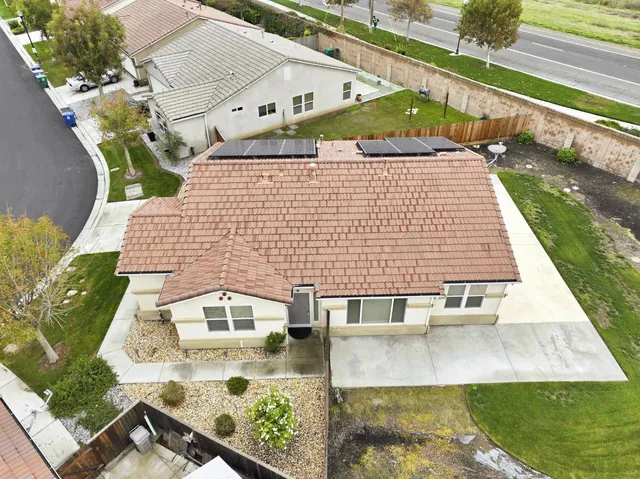 an aerial view of a house with a garden