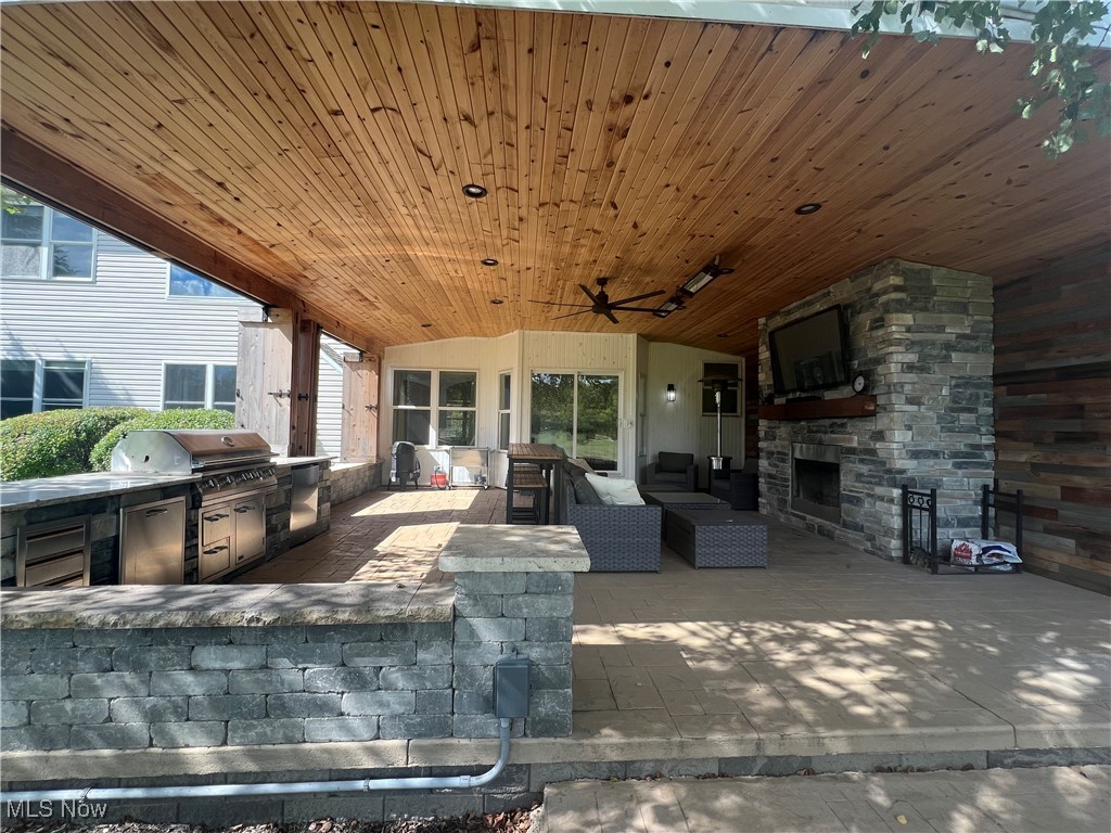 7305 Alexander Road Painesville, OH 44077 - Photo 50 of 50 View of outdoor living area with tv, grill, refrigerator, tv, fan and heaters