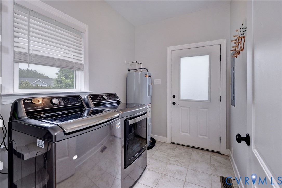8904 Rock Cedar Road New Kent, VA 23124 - Photo 13 of 37 a kitchen with a stove and a microwave