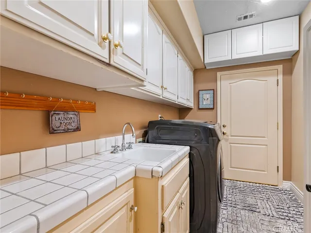 a living room with furniture fireplace and window