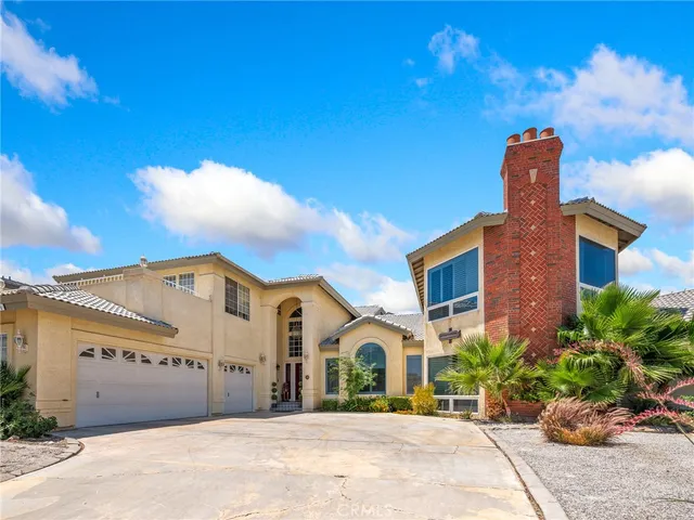 a front view of a building with garden