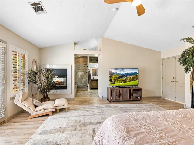 a bathroom with a granite countertop bathtub shower