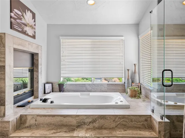 a bedroom with furniture and a flat screen tv