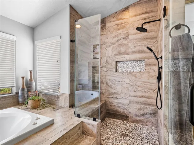 a living room with fireplace furniture and a flat screen tv