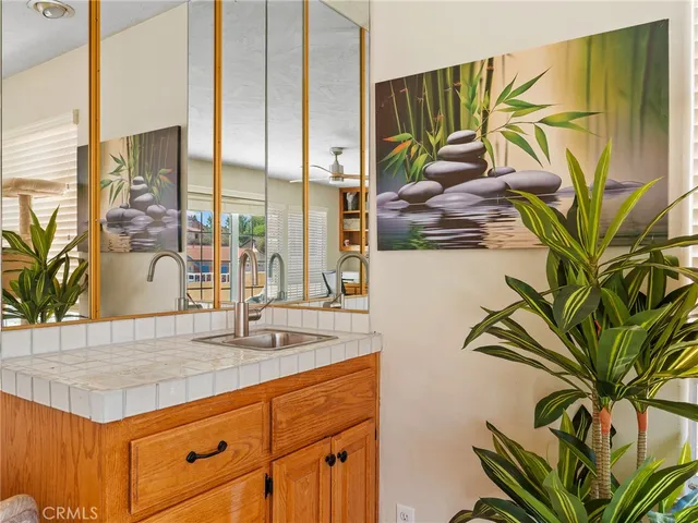 a spacious bathroom with a double vanity sink and a mirror