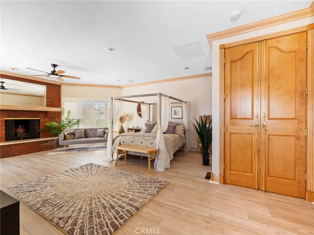 a view of a backyard with couches and swimming pool