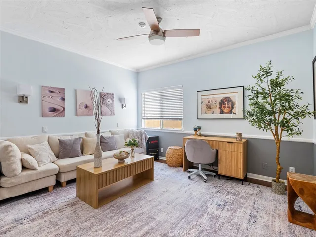 a living room with furniture and window