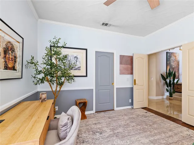 a kitchen with a sink a refrigerator and cabinets