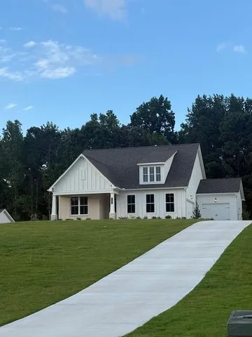 a view of house with garden