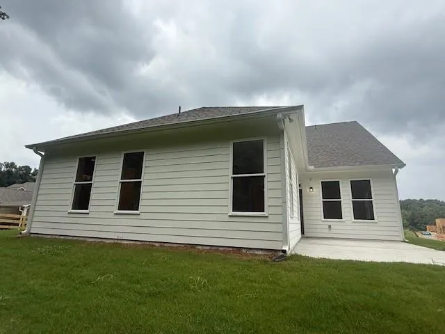 a backyard of a house with lots of green space
