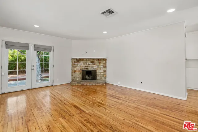 a view of a kitchen with a sink and a stove top oven