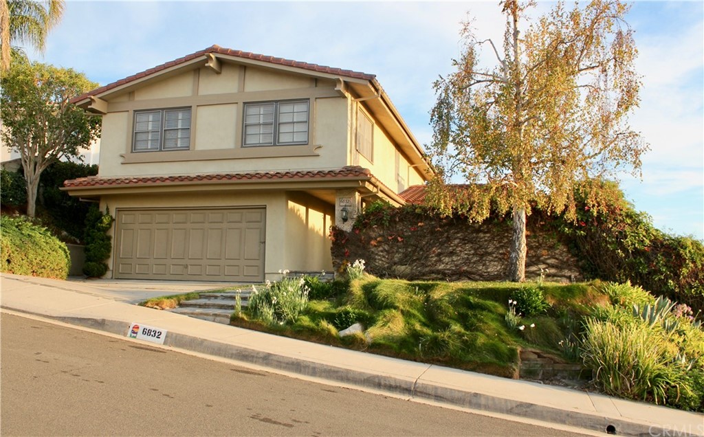6832 Verde Ridge Road Rancho Palos Verdes, CA 90275 - Photo 2 of 26 a view of a house with a small yard plants and a large tree