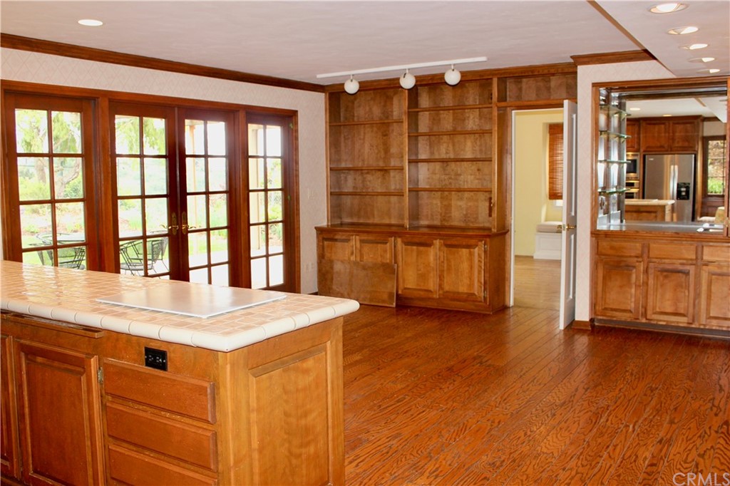 6832 Verde Ridge Road Rancho Palos Verdes, CA 90275 - Photo 12 of 26 a view of an empty room with wooden floor and a window