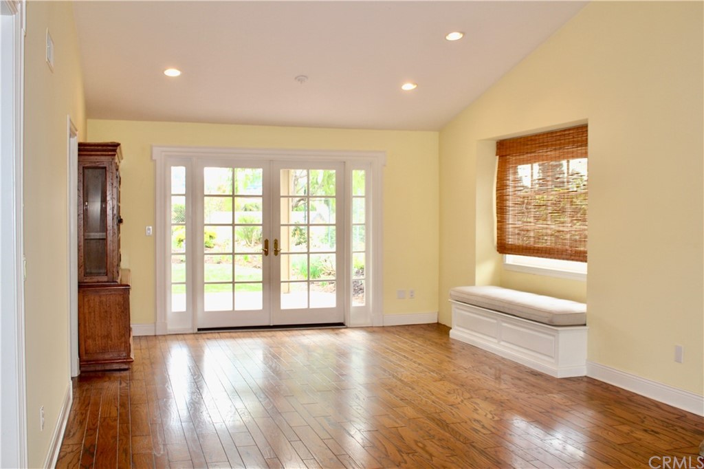 6832 Verde Ridge Road Rancho Palos Verdes, CA 90275 - Photo 5 of 26 a view of an empty room with a window and wooden floor