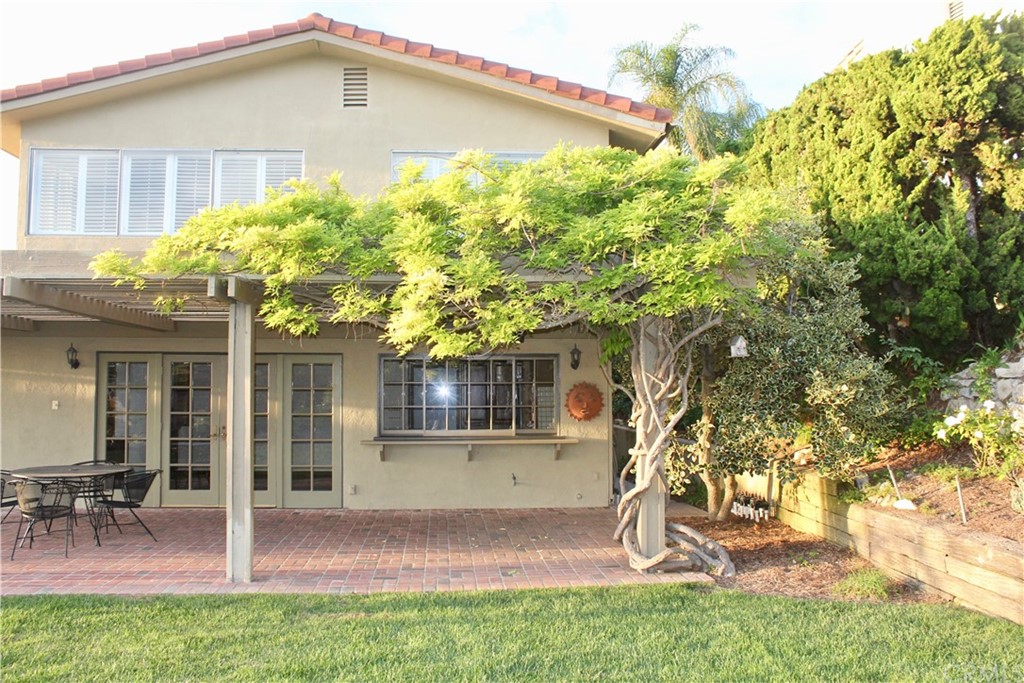 6832 Verde Ridge Road Rancho Palos Verdes, CA 90275 - Photo 7 of 26 a front view of a house with garden