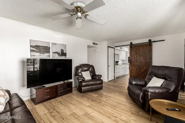 a living room with furniture and a flat screen tv