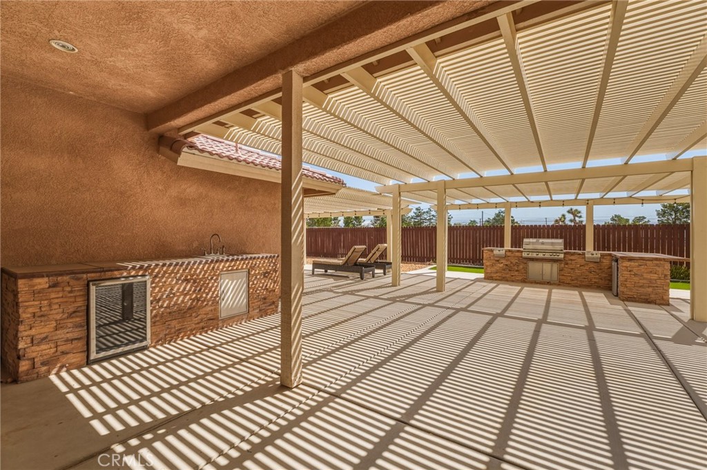 19501 Kinai Road Apple Valley, CA 92307 - Photo 39 of 49 a view of a balcony with wooden floor