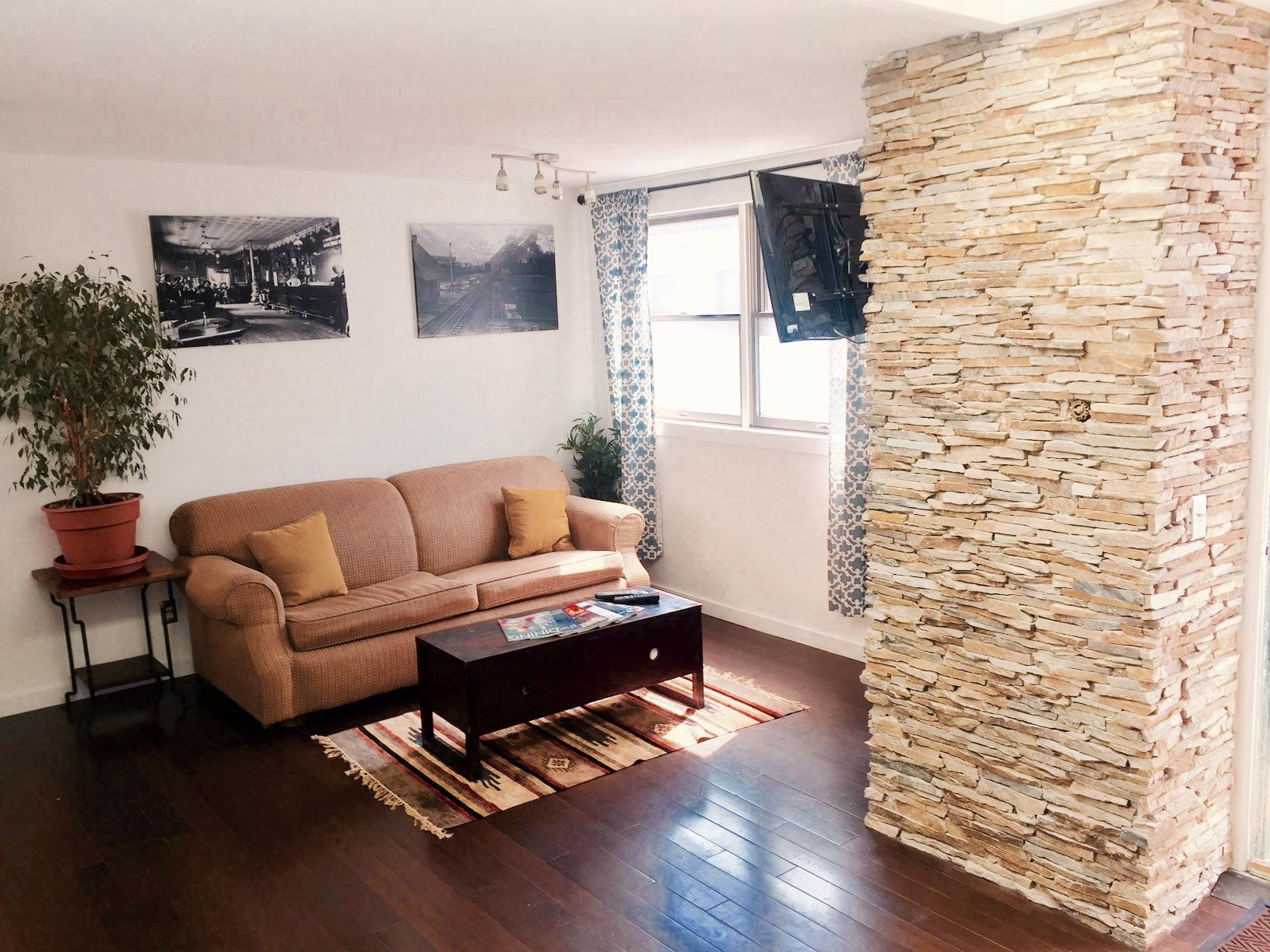 129 West San Juan Avenue, Unit R11 Telluride, CO 81435 - Photo 12 of 18 a living room with furniture and a wooden floor