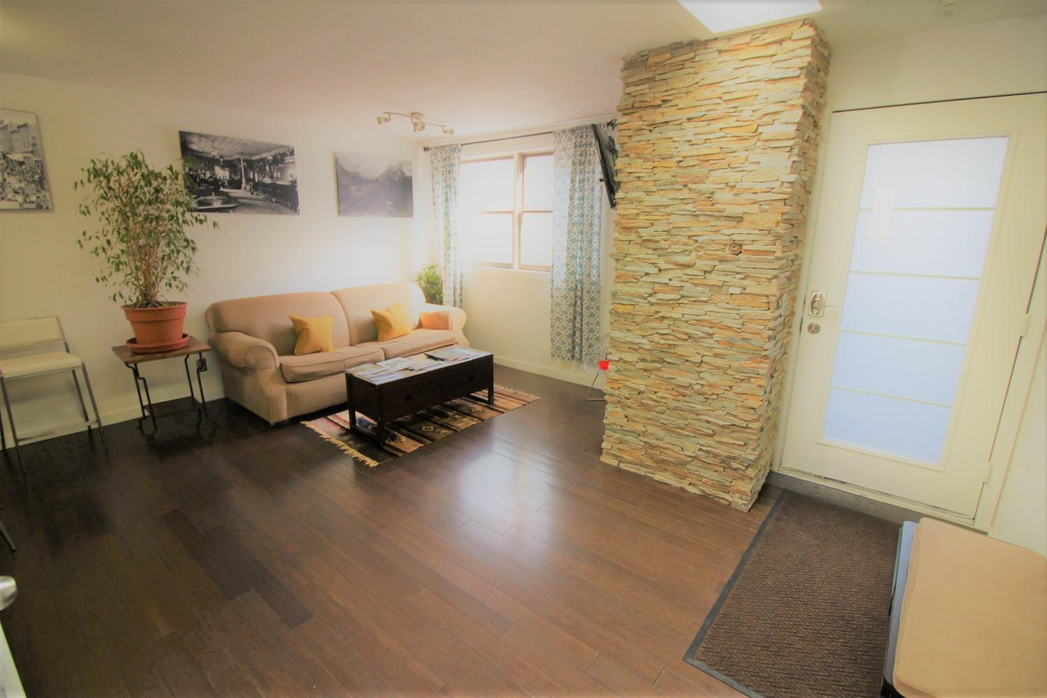 129 West San Juan Avenue, Unit R11 Telluride, CO 81435 - Photo 2 of 18 a living room with furniture and a wooden floor