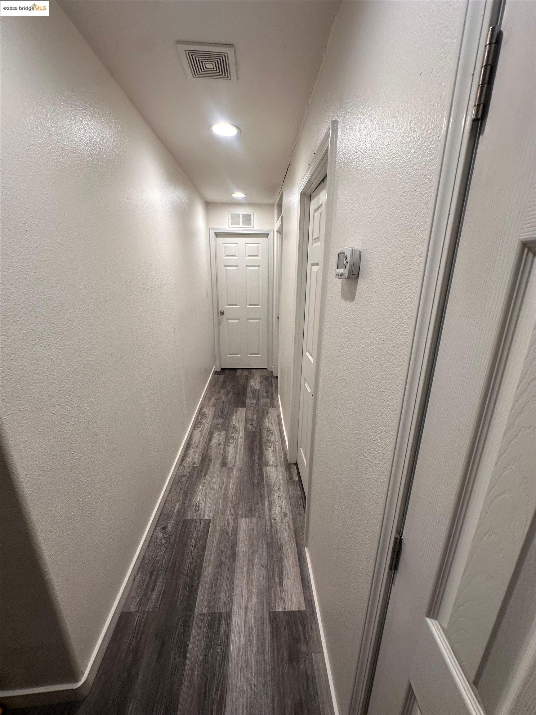 55 Pacifica Avenue, Unit 49 Bay Point, CA 94565 - Photo 11 of 12 a view of hallway with wooden floor