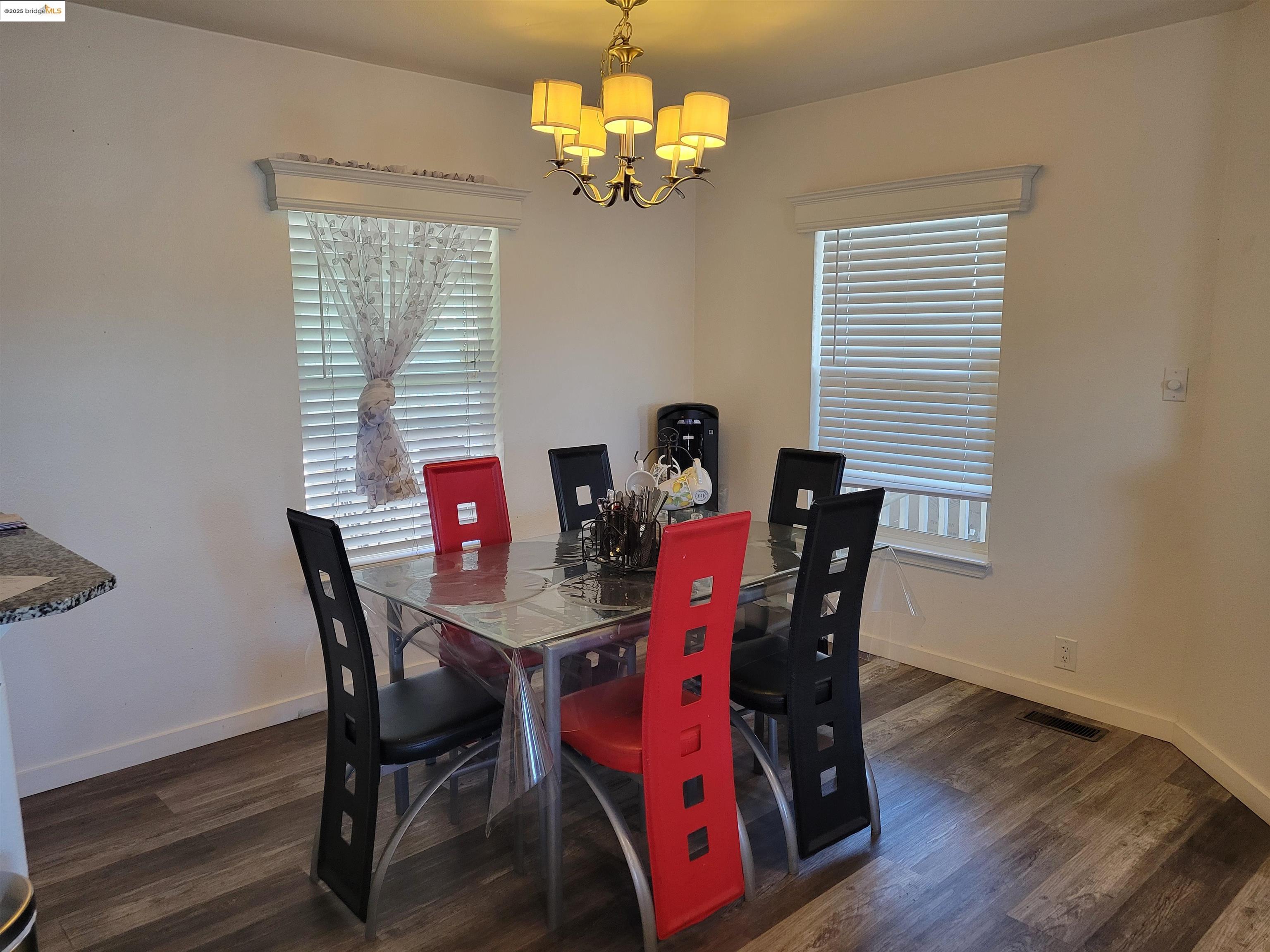 55 Pacifica Avenue, Unit 49 Bay Point, CA 94565 - Photo 2 of 12 a view of a dining room with furniture and chandelier