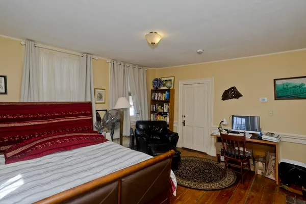 a bed room with a bed and a television