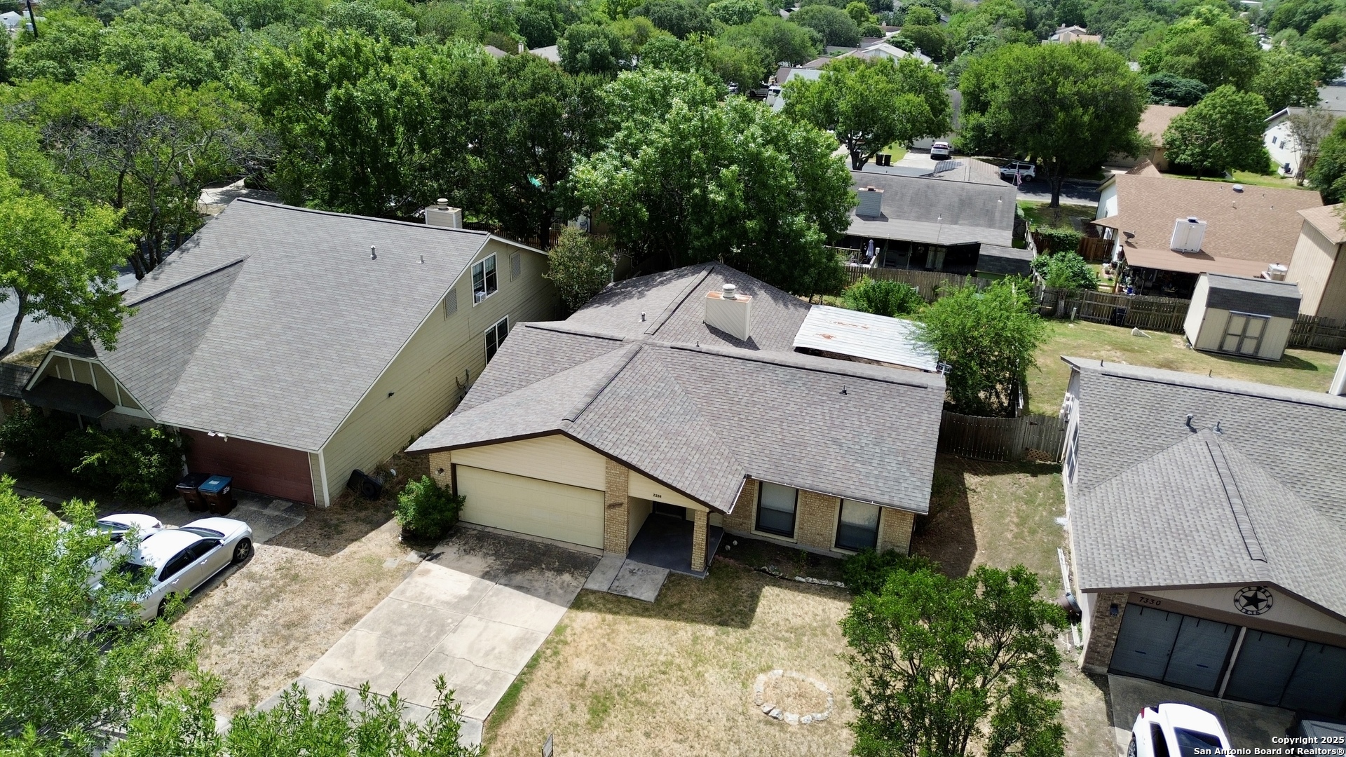 7334 Mystery Ridge Drive Converse, TX 78109 - Photo 2 of 26 an aerial view of a house with a yard