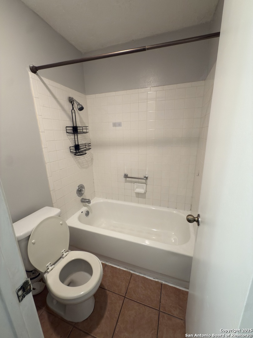 7334 Mystery Ridge Drive Converse, TX 78109 - Photo 22 of 26 a bathroom with a sink a toilet and a bathtub