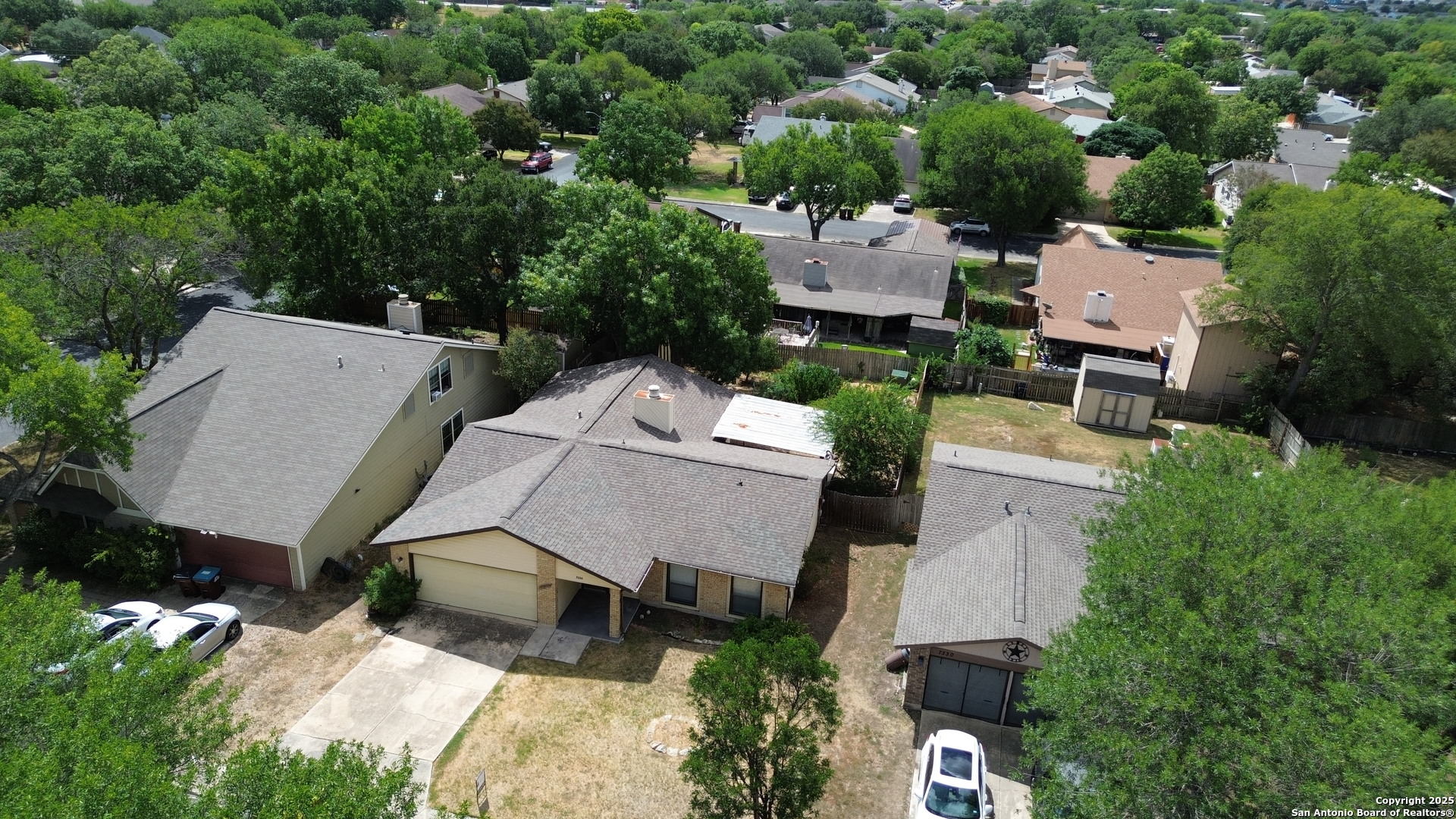 7334 Mystery Ridge Drive Converse, TX 78109 - Photo 3 of 26 an aerial view of a house with a yard