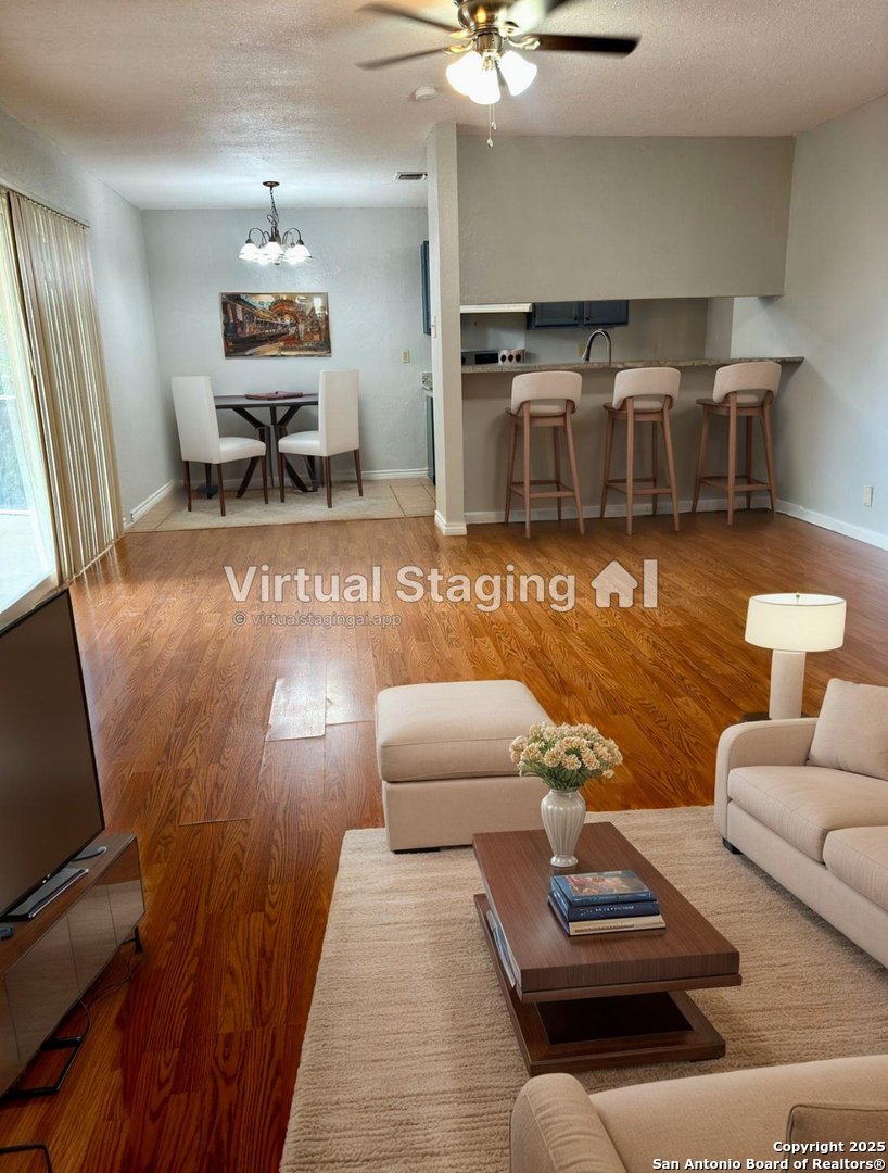 7334 Mystery Ridge Drive Converse, TX 78109 - Photo 9 of 26 a living room with furniture and a flat screen tv