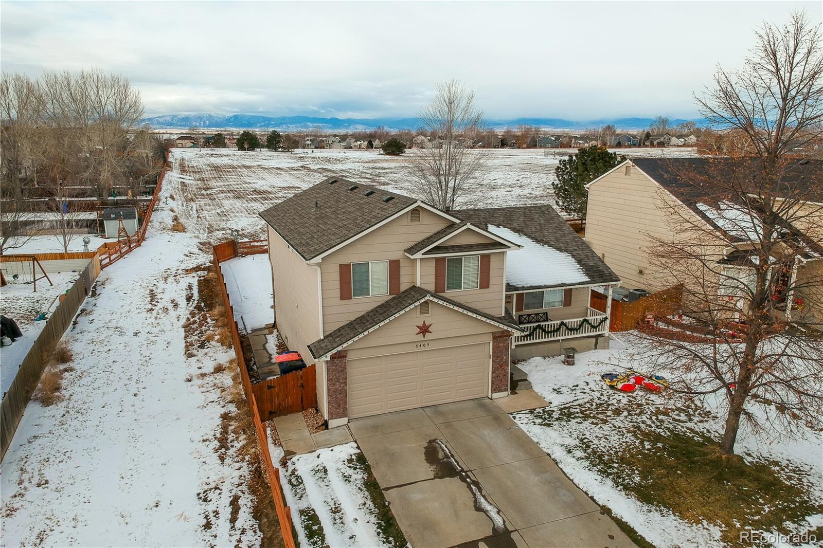 an aerial view of a house with a ocean view