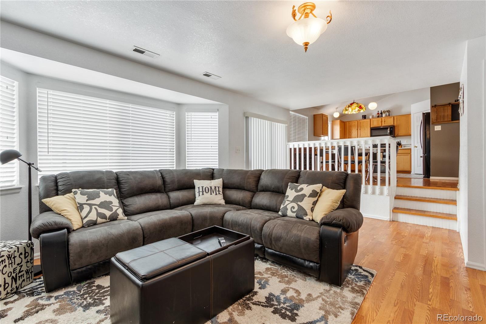 5405 Wolf Street Frederick, CO 80504 - Photo 16 of 36 a living room with furniture and a window