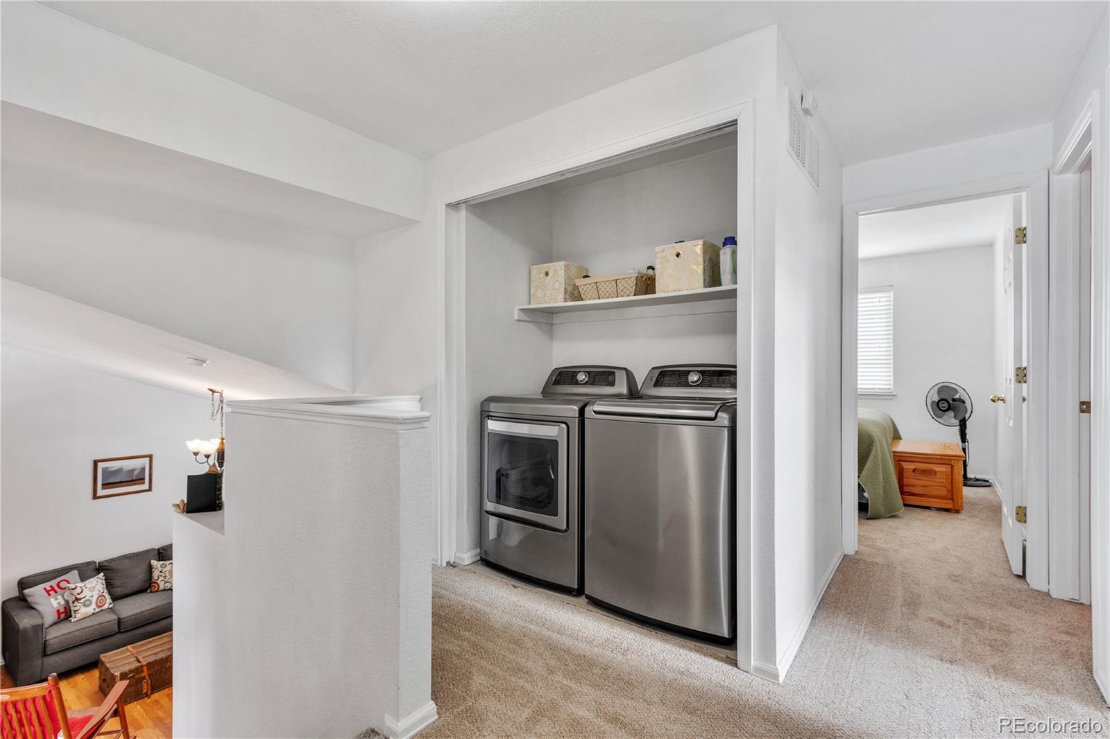 5405 Wolf Street Frederick, CO 80504 - Photo 17 of 36 a kitchen with stainless steel appliances a stove a sink and a refrigerator
