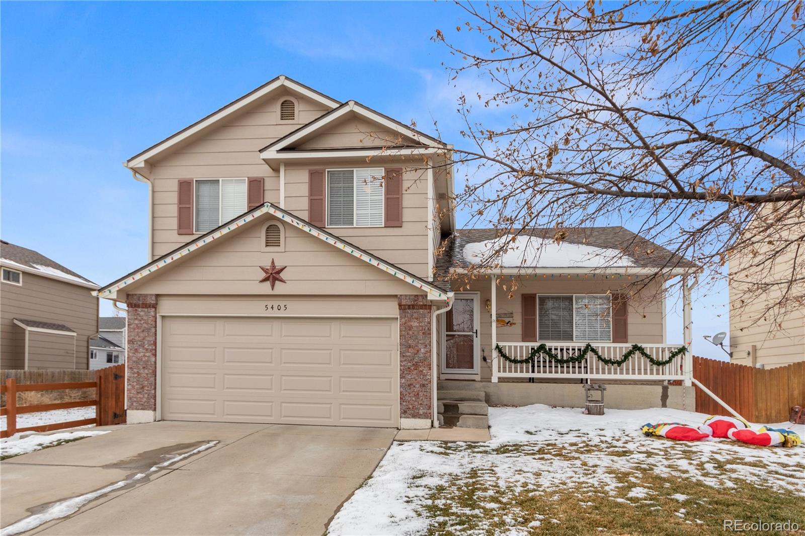 5405 Wolf Street Frederick, CO 80504 - Photo 2 of 36 a front view of a house with a yard