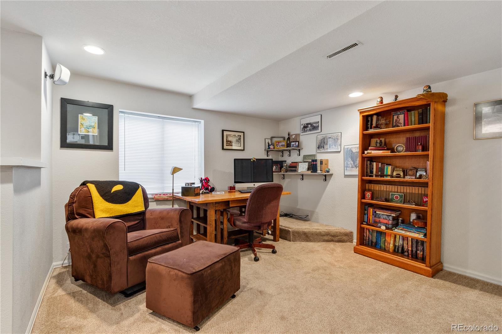 5405 Wolf Street Frederick, CO 80504 - Photo 28 of 36 a view of a livingroom with workspace and a couch