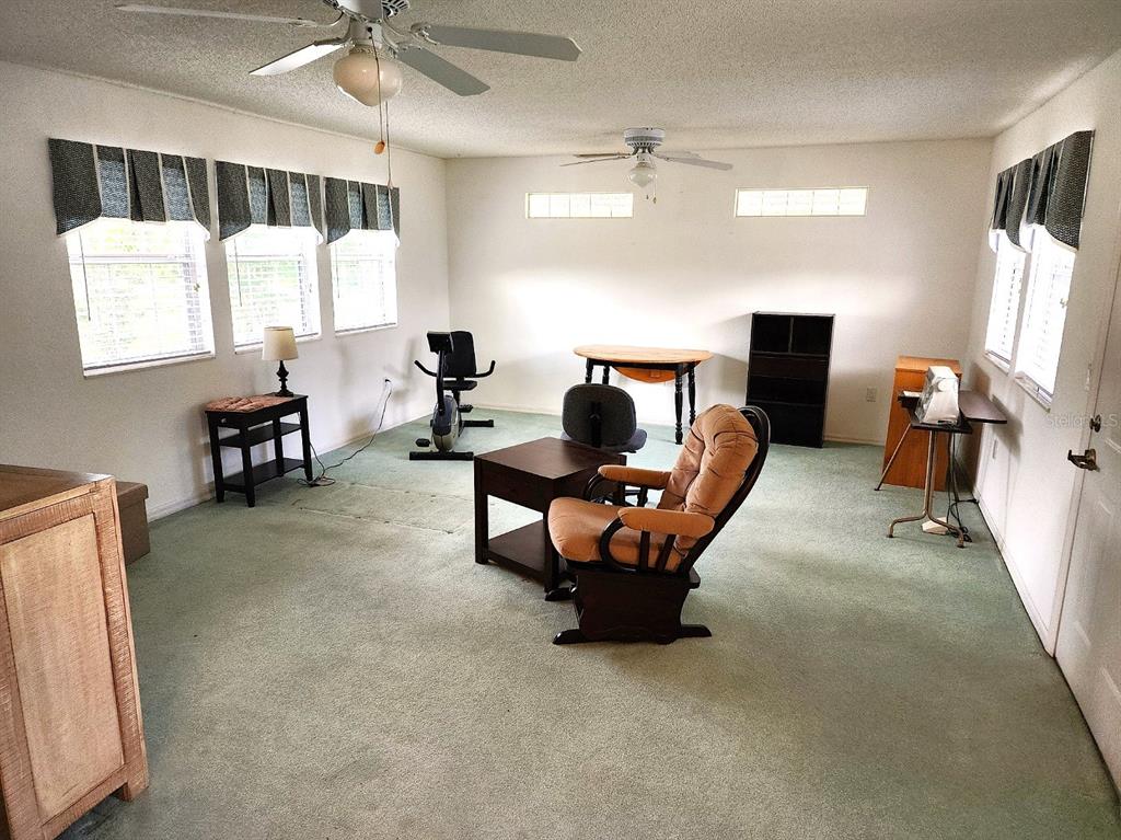 11660 Southwest 89th Terrace Ocala, FL 34481 - Photo 13 of 16 a living room with furniture